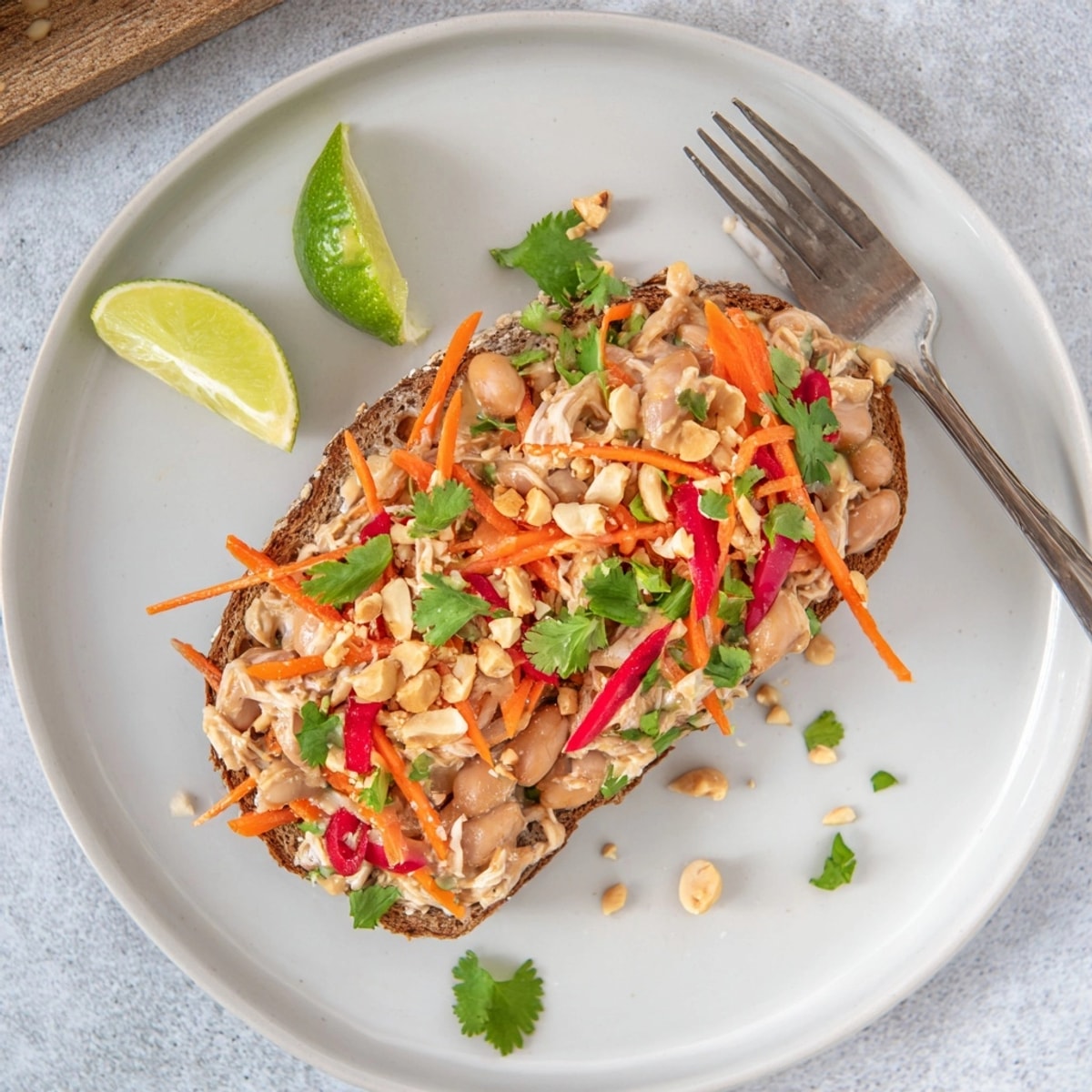 Creamy Thai Peanut Pinto Chicken Toast, a tasty, easy lunch with fresh garnishes.