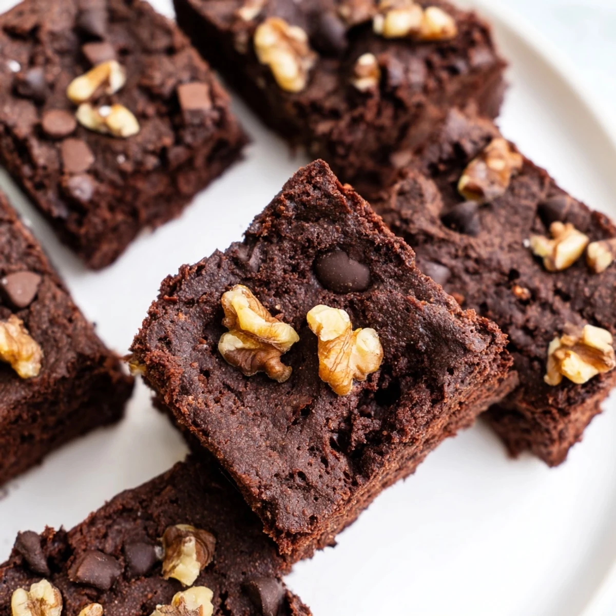 Rich zero-waste brownies using nut-milk pulp, topped with dark chocolate chips.  