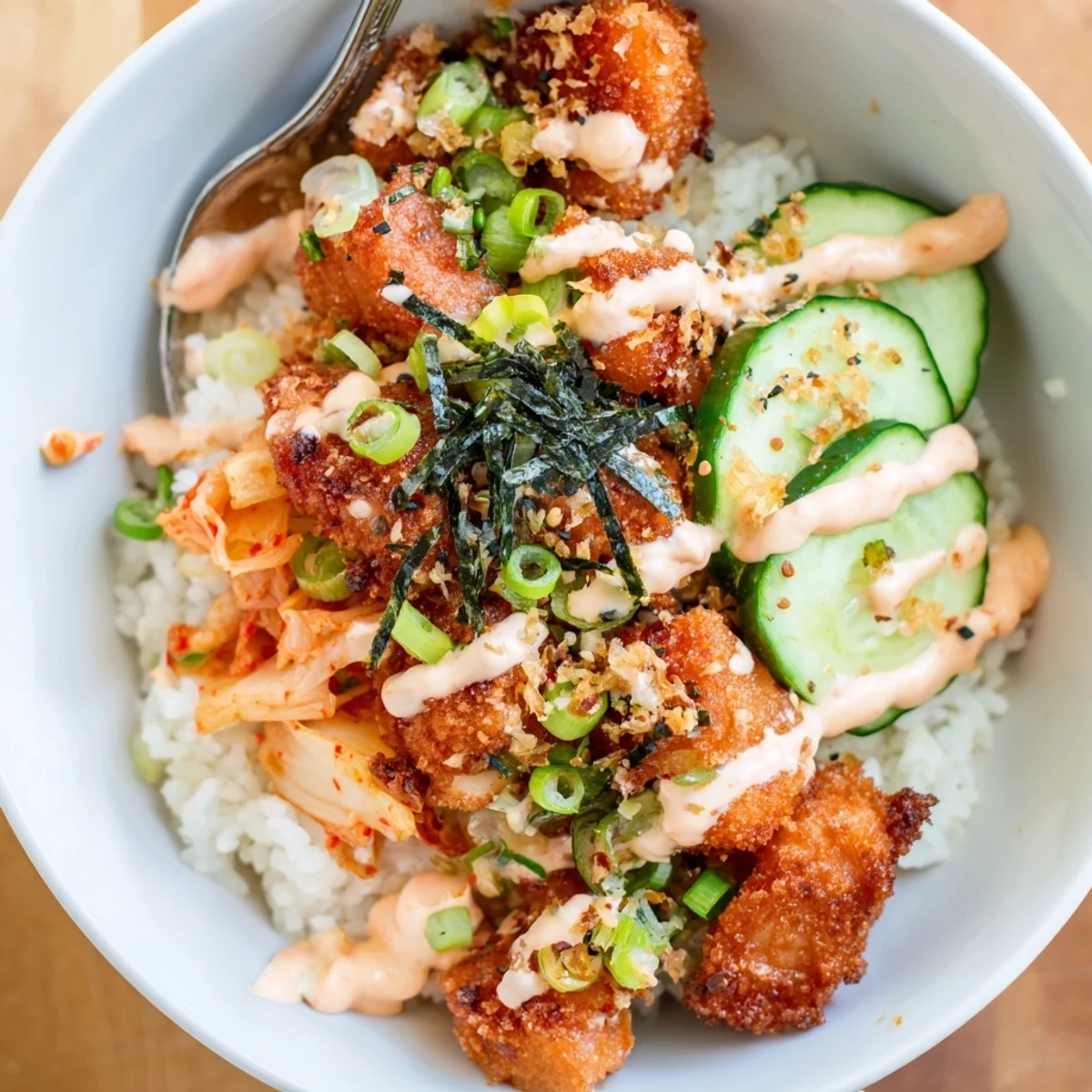 Savor the textures of this Crispy Salmon Rice Bowl with garlic and fresh cucumber.