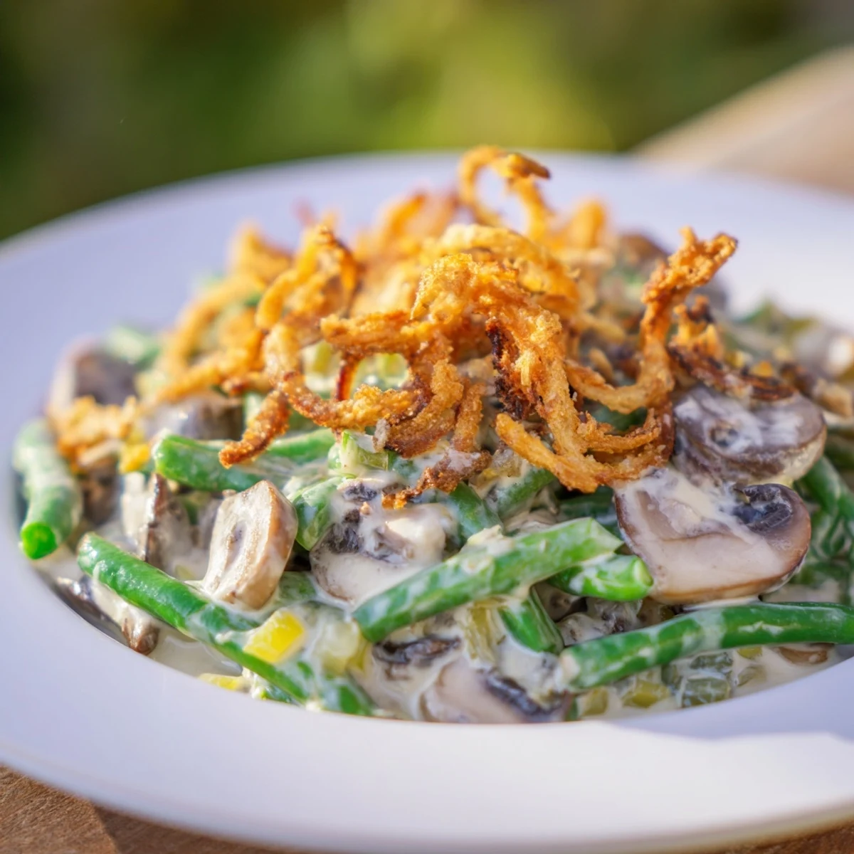 This classic Old-School Green Bean Casserole shows off a creamy sauce and crunchy onion topping.