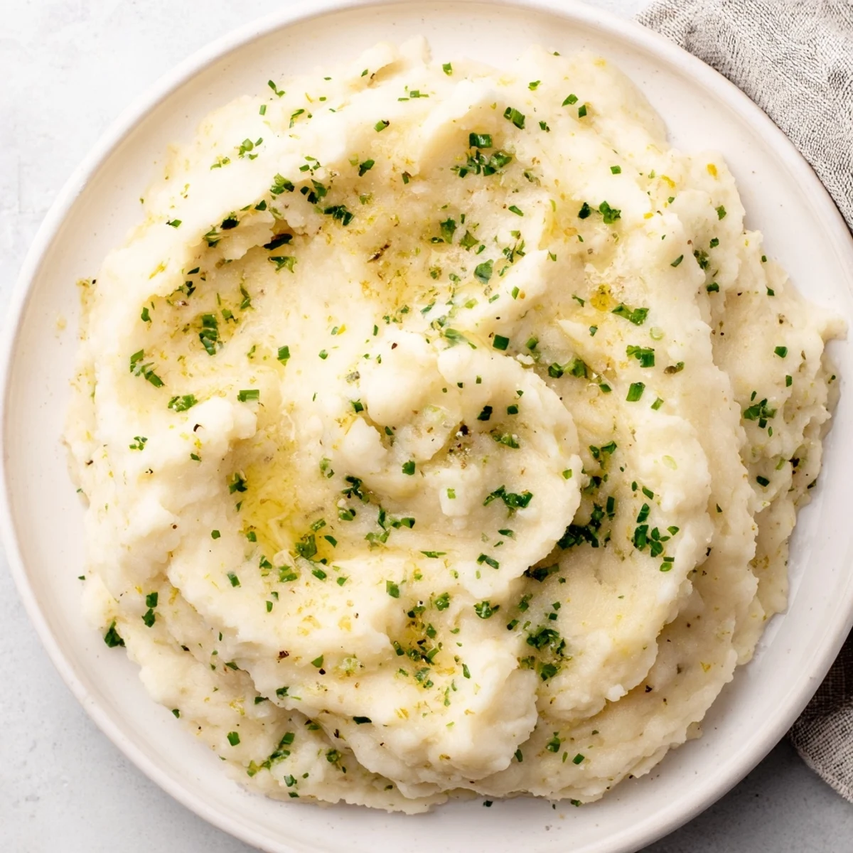 Vibrant image: Creamy cauliflower mash with garlic and lemon, perfect for a cozy, healthy side.