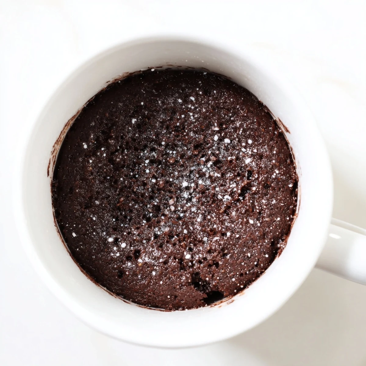Deep and rich chocolate microwave mug cake, cooked to perfection ready in under 5 minutes.