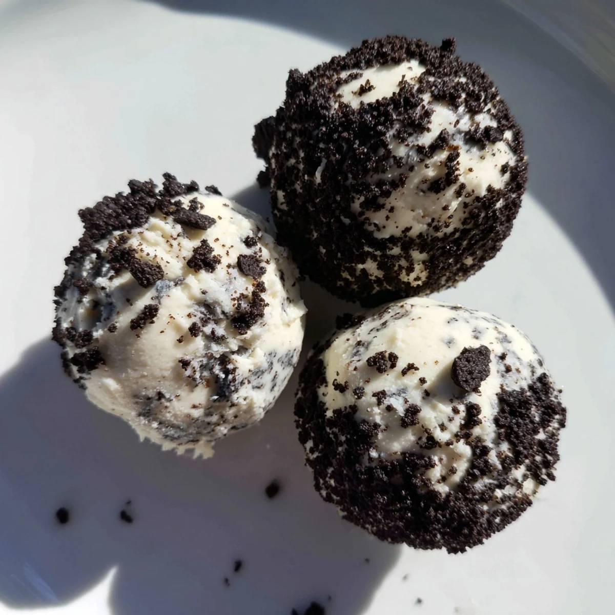 Enjoy a close-up of delicious Cream Cheese Oreo Protein Balls ready to grab and eat.