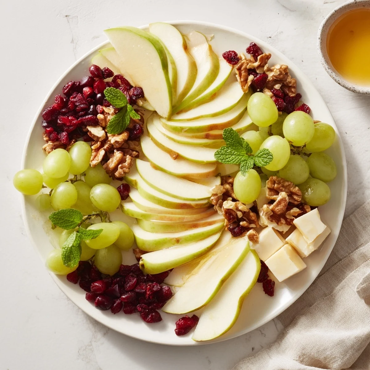 Honey-drizzled Apple Orchard Fruit Board with a delightful combination of sweet and savory elements, ready to serve!