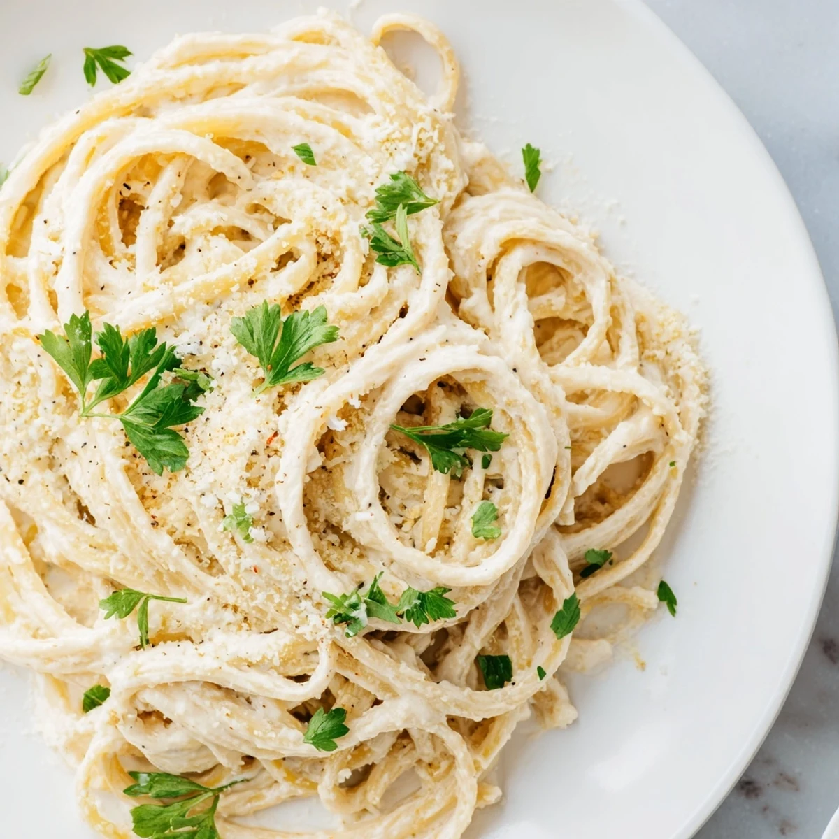 Golden-brown Pasta Alfredo Cottage Hack, where tender pasta meets a delightful cottage cheese sauce.