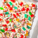 Festive party dessert: sweet, chewy gummy bears and crispy candy canes on a chocolate bark.
