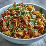 Garnished with fresh cilantro and toasted sesame seeds, this vibrant vegan gochujang swede noodles dish shines.