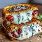 Gooey Pizza Margherita Grilled Cheese sandwich, perfectly grilled with tomato and basil.
