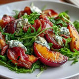 Vibrant Peach Burrata Prosciutto Salad with balsamic glaze and fresh basil.