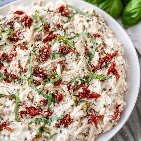 Creamy, bubbly Lightened Marry Me Chicken Dip ready to be scooped up with crackers or veggies.