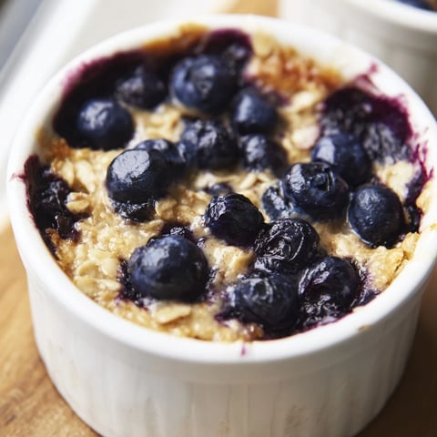 Fluffy, cake-like blueberry baked oats, warm and inviting, ready to enjoy for breakfast.