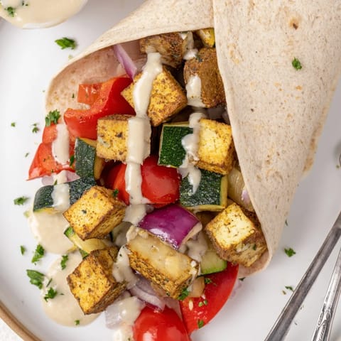 Delicious Vegan Viral Recipe re-make, served with tangy tahini-yogurt sauce and herbs.  