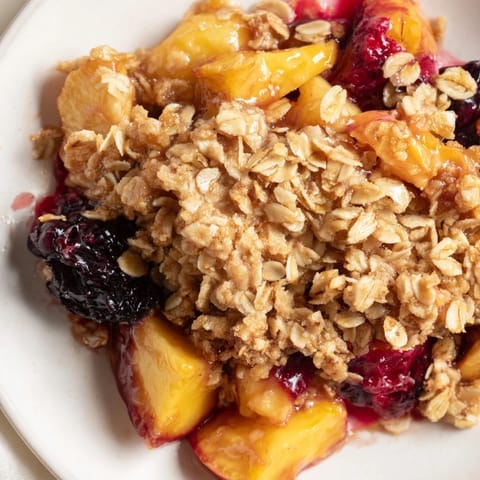 Warm, bubbly oven-baked Fruit Crisp with a crispy oat topping, a comforting American dessert.