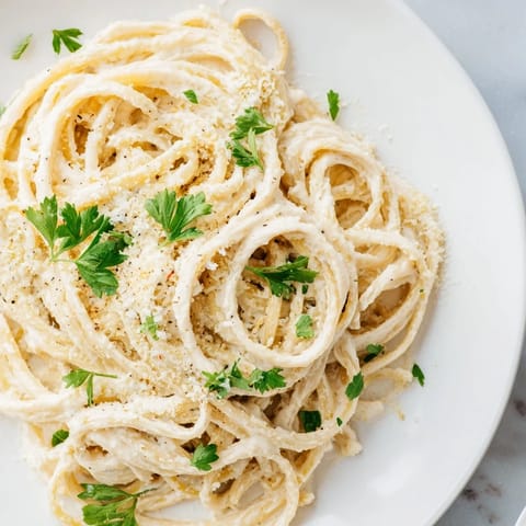 Golden-brown Pasta Alfredo Cottage Hack, where tender pasta meets a delightful cottage cheese sauce.