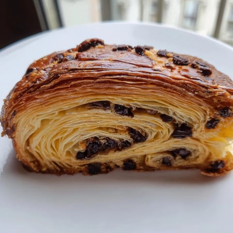 Warm, freshly baked Crookie with a crispy croissant exterior and soft, cookie interior awaits.