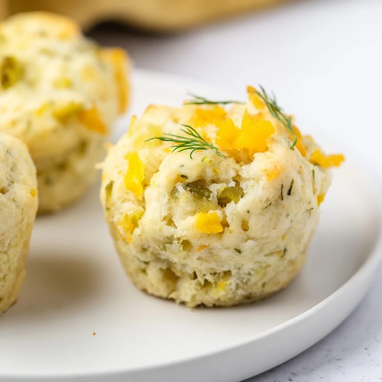 Tender biscuits packed with dill pickles and spicy jalapeños, a unique snack idea.  