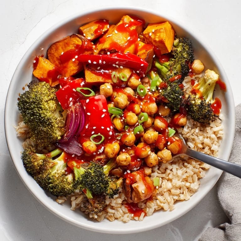 Delicious Bold Sauce Drizzle Bowls featuring gochujang-maple sauce and colorful ingredients.  
