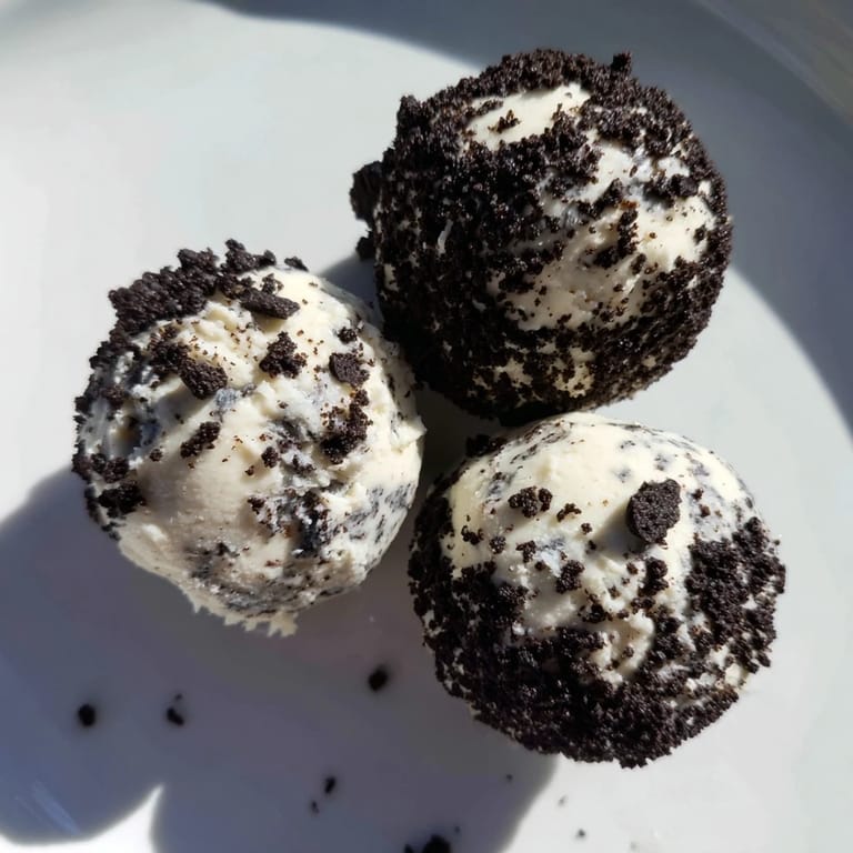 Enjoy a close-up of delicious Cream Cheese Oreo Protein Balls ready to grab and eat.