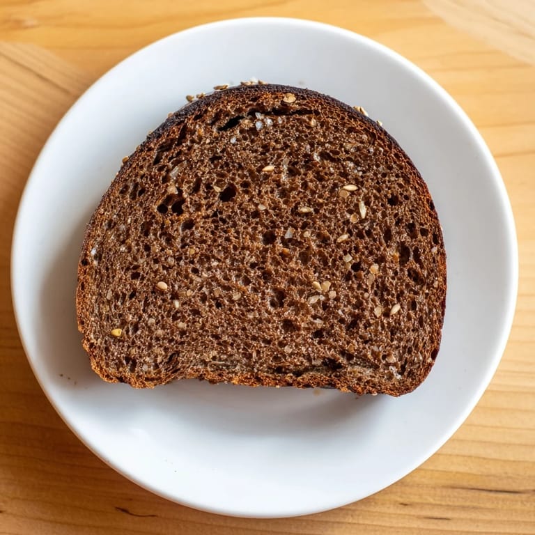 Warm, aromatic Estonian Leib sourdough, with caraway seeds, waiting to be slathered in butter.