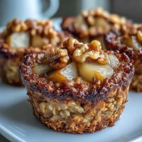 Golden Pear Vanilla Baked Oatmeal Cups with warm spice, perfect for breakfast.